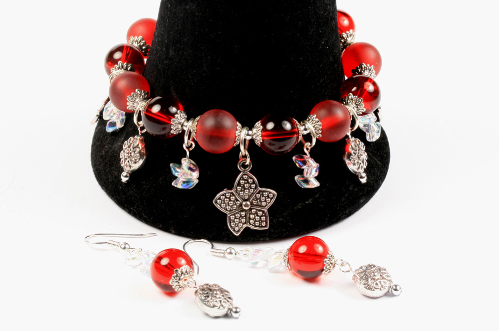 Strung charm bracelet with dangles